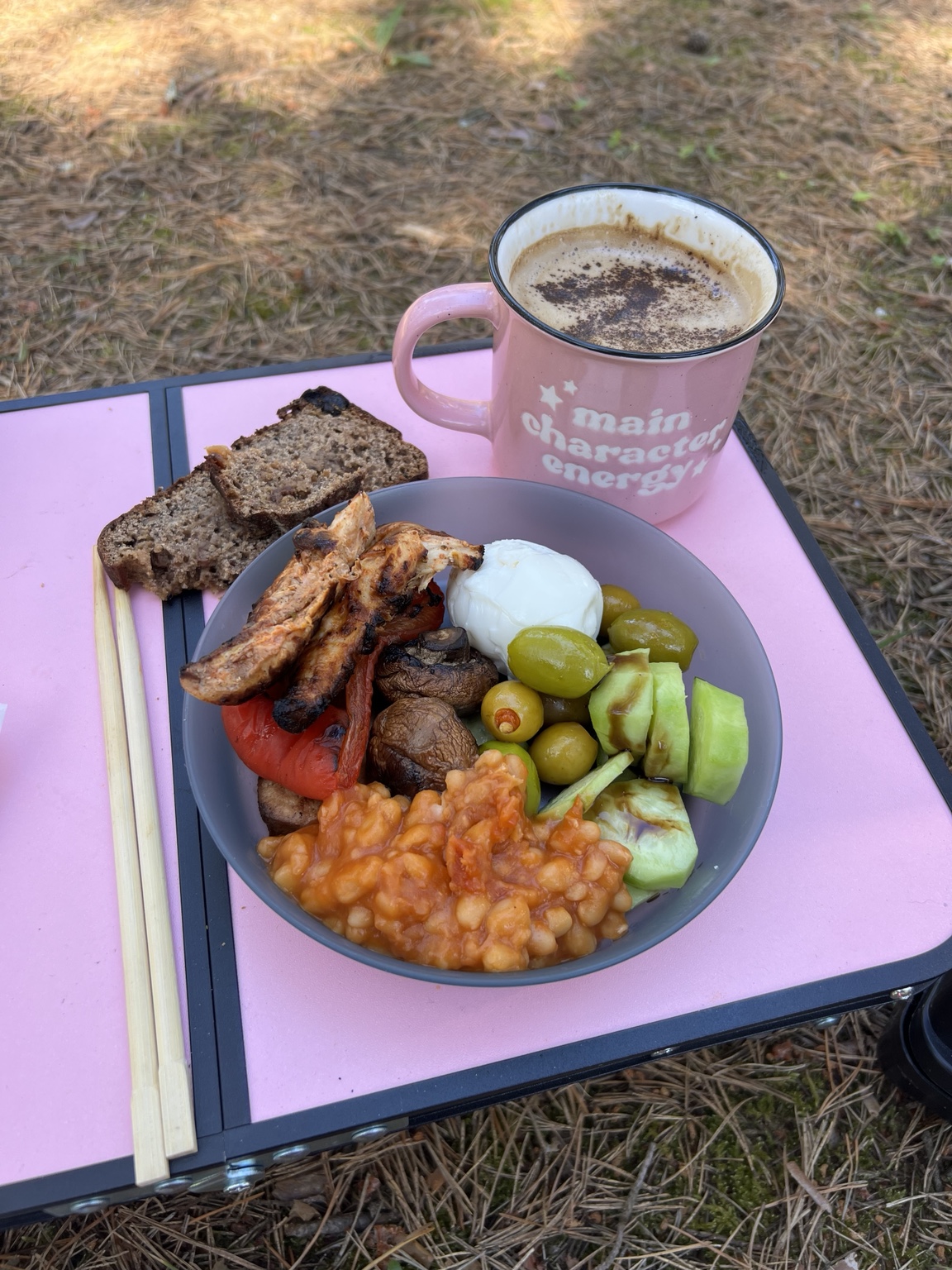 Breakfast made with grilled leftovers, baked beans, cucumber, olives and a boiled egg