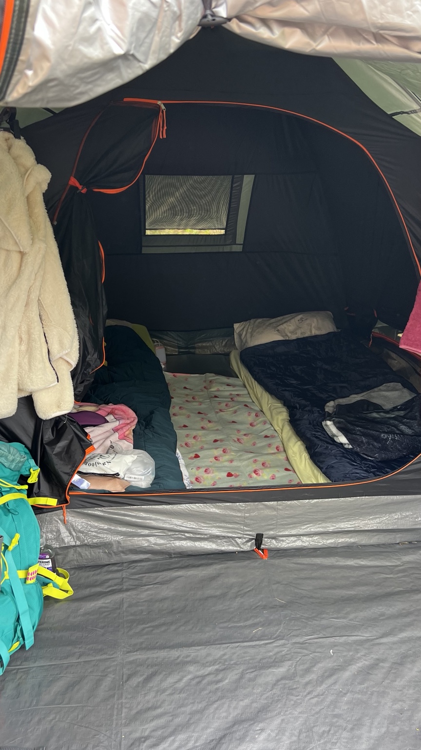Two separate beds arranged inside the tent at Plaucaki campsite